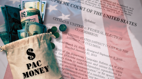 A brown sack of money sits on top of an American flag and a transparent copy of the Supreme Court decision on Citizens United vs. FEC. 