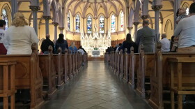 Rev. Paul O'Brien led mass at St. Patrick Parish in Lawrence Sept. 23. (Callum Borchers/WBUR)
