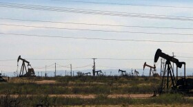Oil rigs stand in the Loco Hills field along U.S. Highway 82 in Eddy County, near Artesia, N.M. (Jeri Clausing/AP)