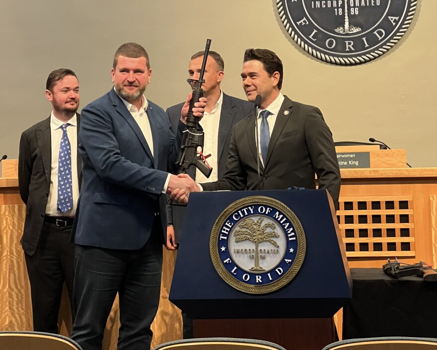 Commissioner Ken Russell shakes hands with Oleksandr Markushyn, the Mayor of Irpin.