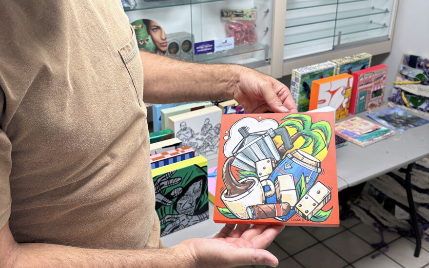 Krave holding one of the various 8x8 pieces that'll be available at El Fresco's grand opening