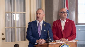 State Sen. Rick Brattin, a Republican from Harrisonville, and Secretary of State Denny Hoskins speak to reporters outside Hoskins's office in the Missouri State Capitol Tuesday. The press conference also drew in LGBTQ+ advocates who criticized the two officials for attacks on a "rainbow story time" held in Columbia Saturday.