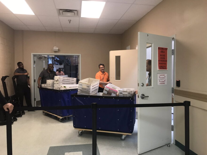 Three cart loads of ballots are brought into the Broward Elections office for the canvassing board to examine on Thursday, Nov. 8, 2018.