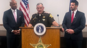 Sheriff Jerry Goodin speaks about the program flaked by Indiana Attorney General, Curtis Hill, (pictured left) and Scott County Prosecutor, Chris Owens (pictured right).