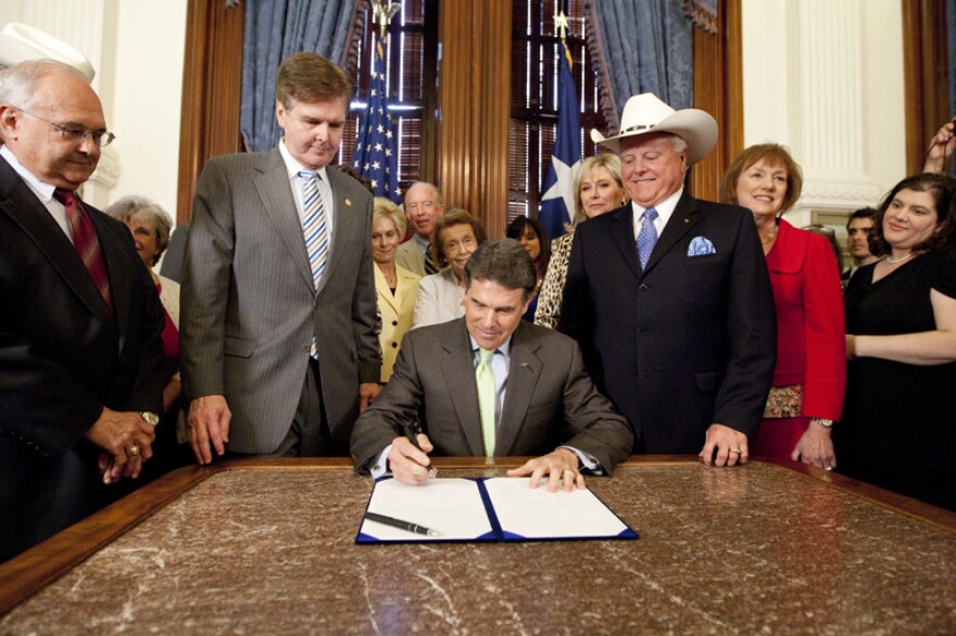 Texas Governor Rick Perry signs legislation requiring women to get sonograms before they get an abortion.