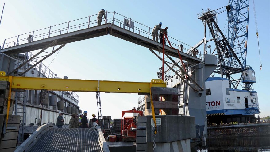 The Navy’s oldest floating dry-dock, the Mid-Atlantic Regional Maintenance Center’s (MARMC) Dynamic, (AFDL 6), prepares to be towed from Joint Expeditionary Base Little Creek-Fort Story (JEBLCFS) to Lyons Shipyard Inc., in Norfolk, Virginia for a scheduled Docking Planned Maintenance Availability. (Photo courtesy - Department of Defense)