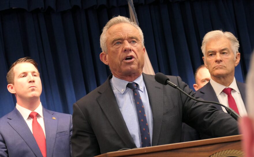 Health and Human Services Secretary Robert F. Kennedy Jr. speaks at a news conference on May 21, 2026, in Minneapolis with Centers for Medicare and Medicaid Services Administrator Dr. Mehmet Oz, right, and law enforcement officials to announce charges against 15 people for allegedly defrauding Medicaid programs of $90 million.