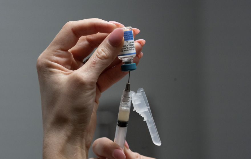 FILE - Lauren Ellenburg, a nurse, prepares a combination measles, mumps and rubella vaccine for a patient at Tiger Pediatrics in Easley, S.C., March 17, 2026.