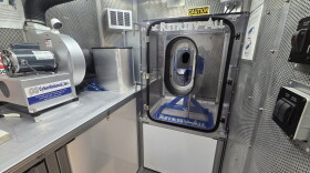 A device in the Crime Gun Intelligence Mobile Command Center allows deputies to safely fire a weapon in order to obtain a spent shell casing. The marks on that casing are then analyzed using computers in the mobile center to find matches in the ATF's database.