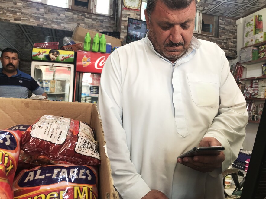 Jamal Abdullah Naser watches a video of a teenager he says is his son, Khaled Jamal Abdullah, just before he died in custody of the Navy SEAL. The young fighter was captured after an airstrike near Mosul and was killed by a Navy SEAL medic who was treating him. Naser was never told what had happened to his son.