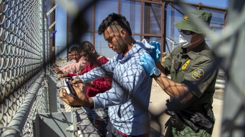 Migrants are pat down by a Border Patrol agent as they enter into El Paso, Texas from Ciudad Juarez, Mexico, Wednesday, May 10, 2023. President Joe Biden’s administration on Thursday will begin denying asylum to migrants who show up at the U.S.-Mexico border without first applying online or seeking protection in a country they passed through, according to a new rule released Wednesday, as U.S. officials warned of difficult days ahead as a key limit on immigration is set to expire. (AP Photo/Andres Leighton)