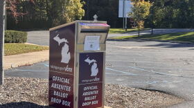 Official Absentee Ballot Drop Box with Michigan logo and Green Oak Charter Township notice.
