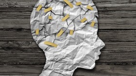 Child psychology and psychiatric therapy for children concept as broken crumpled paper taped together as an education support and medical or counselling treatment metaphor in a 3D illustration style.