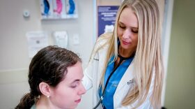 Emmalyn Pratt tends to a patient as part of her studies at the Sonoran University of Health Sciences in Arizona to become a naturopathic doctor.