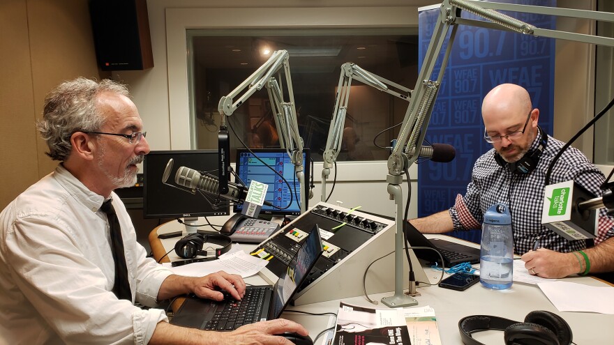 WFAE reporter David Boraks, left, and WUNC reporter Jeff Tiberii prepare for a pre-election special at WFAE. 