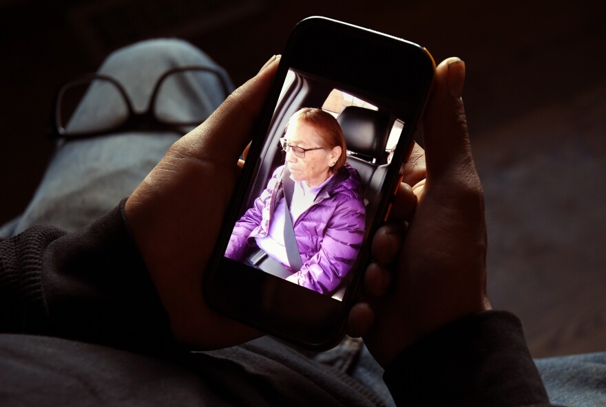 Gerald Begay, whose mother Ella Mae Begay went missing from her home, shows a photo of her on his phone in Denver, Thursday, April 2, 2026.
