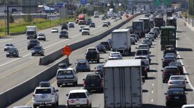 Truck and automobile traffic mix on Interstate 5, headed north through Fife, Wash., near the Port of Tacoma in 2016. (Ted S. Warren/AP)