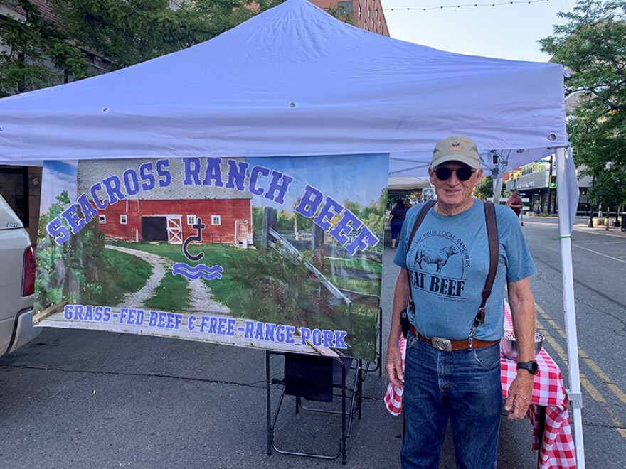 Ron Winters poses by the Seacross Ranch Beef table at the Yellowstone Valley Farmers Market in July 2022