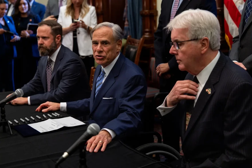 State Rep. Dustin Burrows, Gov. Greg Abbott and Lt. Gov. Dan Patrick at the Capitol in Austin on April 23, 2025.