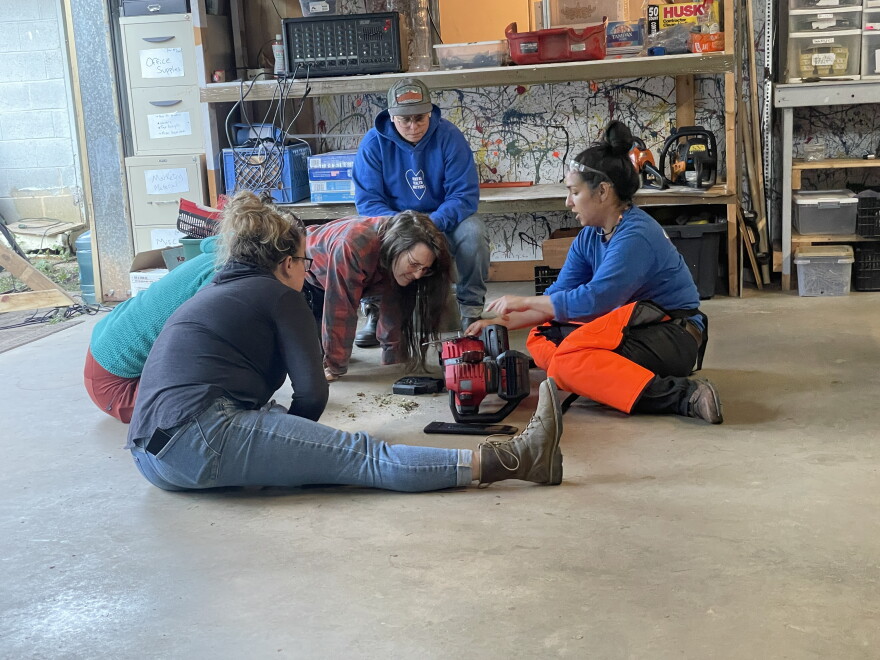 People learning how to use tools