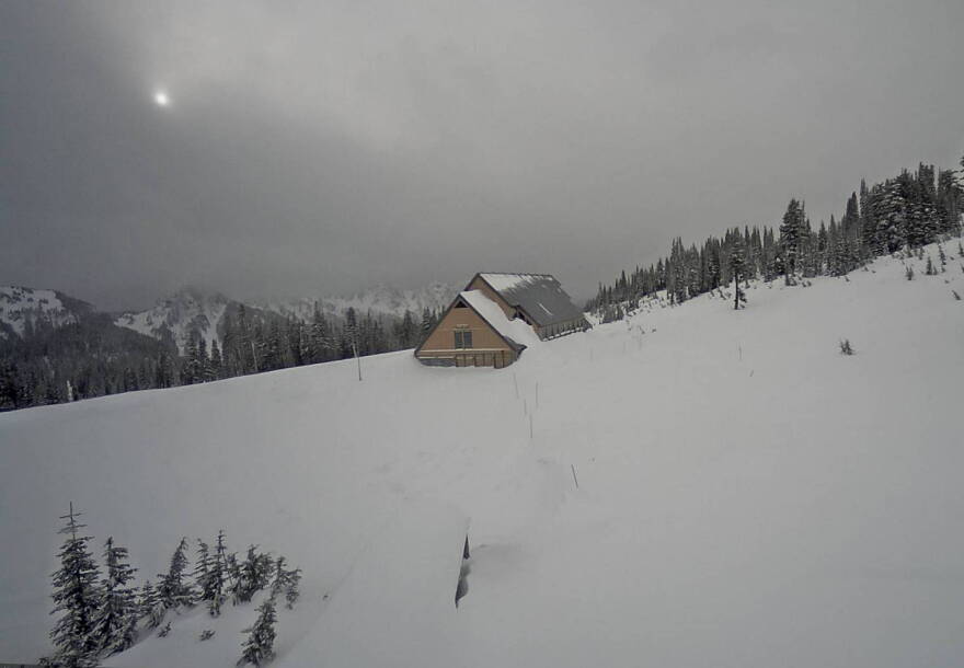 Deep snow surrounds the closed Jackson Visitor Center at Paradise in Mount Rainier National Park in this webcam view Sunday.