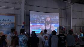 Hundreds of Sewardites gathered at the Dale R Lindsay Alaska Railroad terminal Monday night to watch Seward sensation Lydia Jacoby swim for Olympic gold. (Sabine Poux/KDLL)