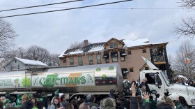 The 10,000 gallon tanker truck completes the end of the Green Beer Sunday parade.