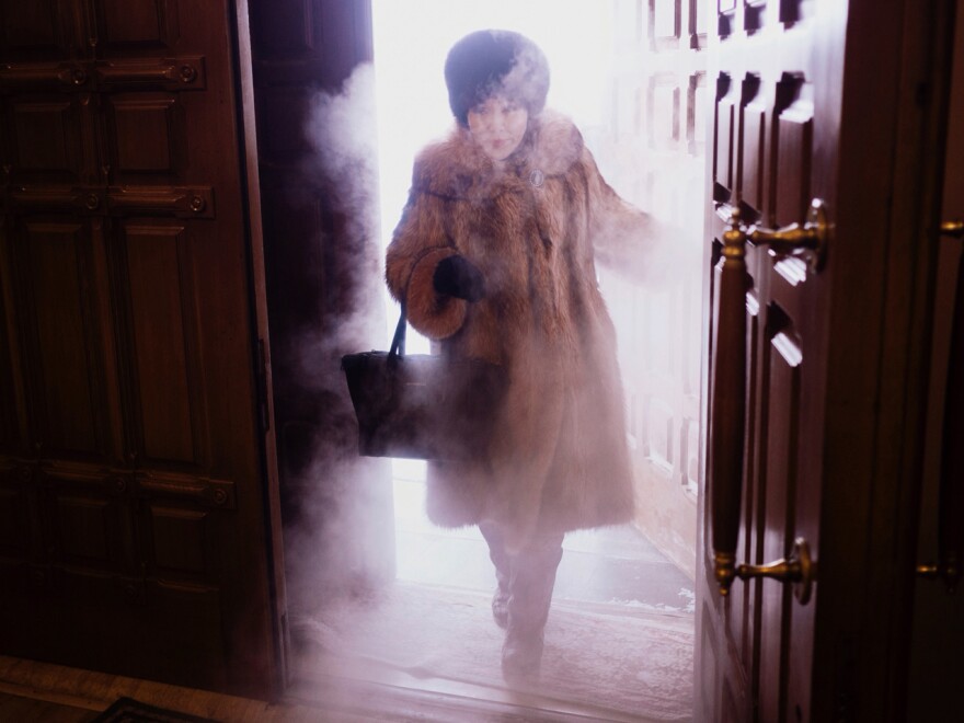 A woman enters Preobrazhensky Cathedral in Yakutsk. "You get this blast of freezing mist coming through the door," photographer Amos Chapple says. "It was just spectacular."