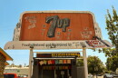 The 7UP billboard in Merced sits on Main Street next to the restaurant Maria’s Mexican Kitchen.