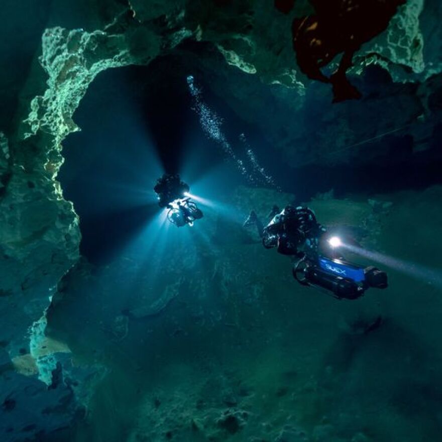 Divers with the Woodville Karst Project exploring the connection between 2 massive cave systems under Wakulla County.