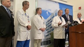 Sarasota Memorial Hospital chief medical officer James Fiorica addresses a press conference Tuesday, with Congressman Vern Buchanan to his right 