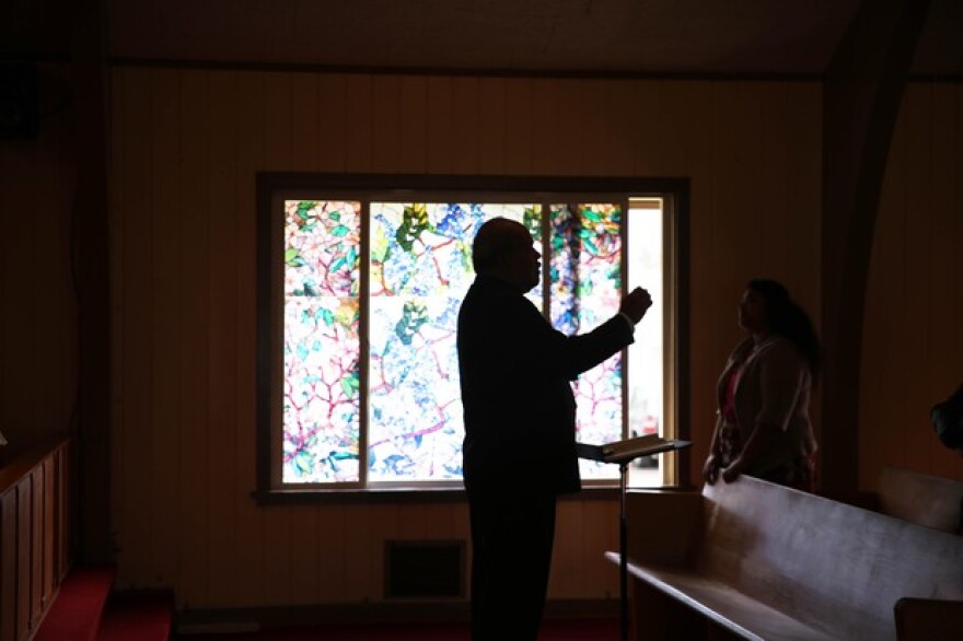 <p>Suliasi Laulaupeaalu directs the choir on a Sunday afternoon at the Lents Tongan Fellowship of the United Methodist Church</p>