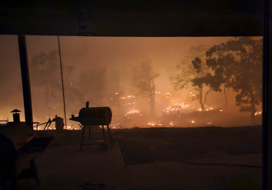 This photo supplied by Cody Masterson shows the Grasshopper Fire approaching Masterson's home, Aug. 10, 2026.