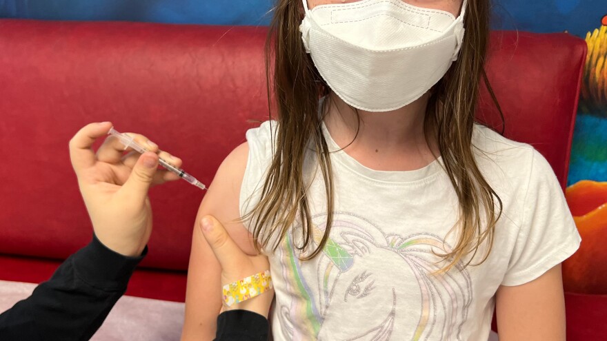 8 year old girl child COVID-19 vaccine shot