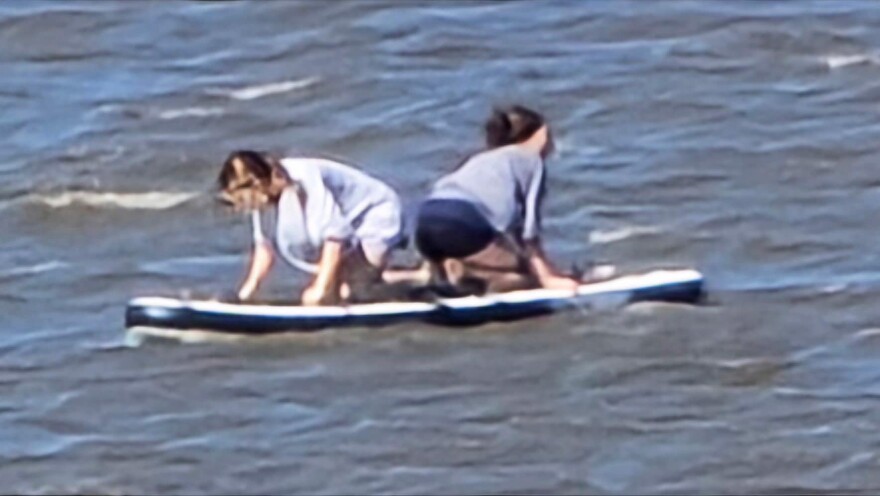 Avery Bryan and Eva Aponte trapped on an inflatable raft as pictured by a bystander. In a photo shared on Facebook, numerous volunteers and officials raced to find the teens after they spent 16 hours adrift in the gulf waters outside of Cedar Key.