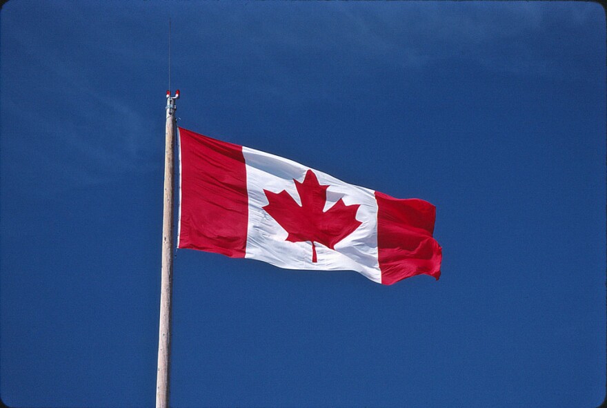 the canadian flag blows in the wind