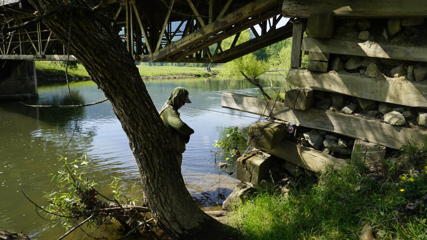 Kyle Chanitz makes a gear change while fishing on a Project Healing Waters trip to Wolf Creek in Bland County, Virginia.