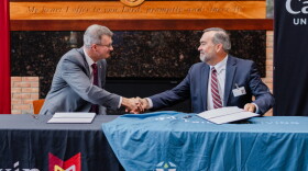 Calvin University President Greg Elzing (left) and Trillium Living CEO Troy Vugteveen.