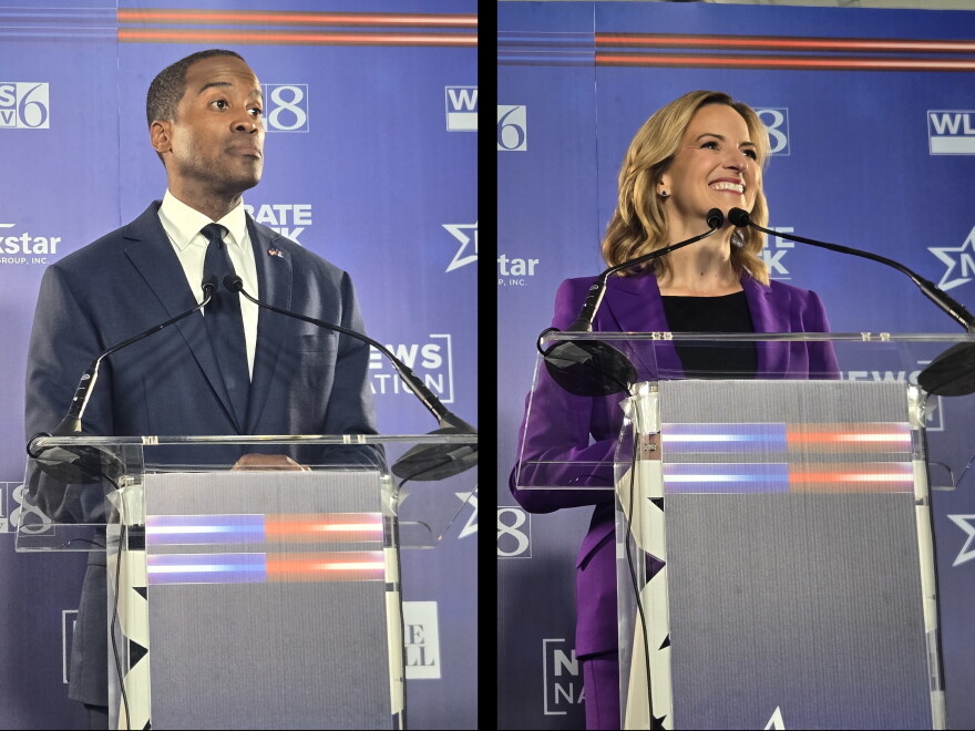 Republican John James and Democrat Jocelyn Benson stand at their lecterns during a gubernatorial debate on October 6, 2026.