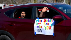 outh Bend Community School's Madison STEAM Academy teachers drive through neighborhoods to waive to their students after the state announced school buildings would be closed for the academic year.