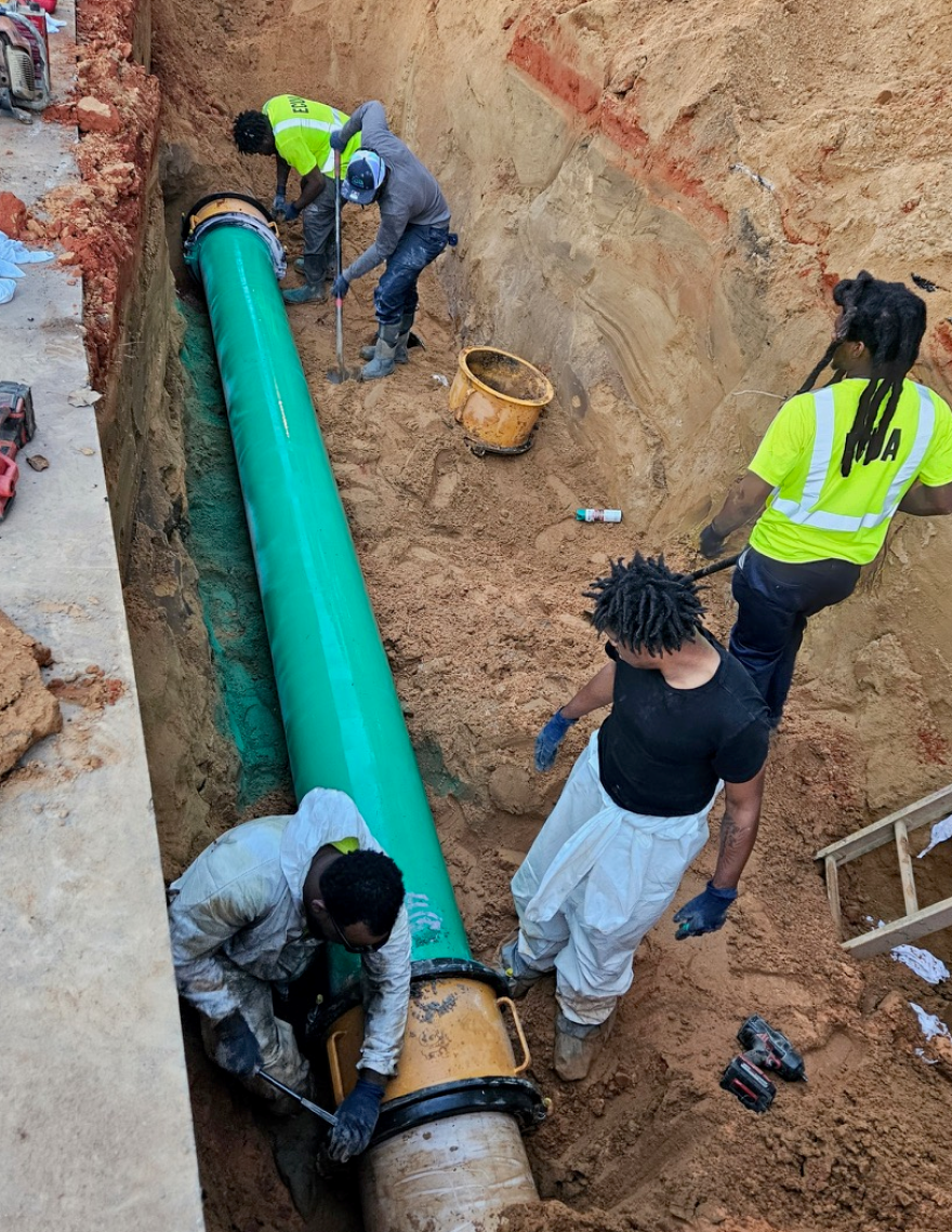 ECUA employees repair a cast iron force main on Wildflower Lane