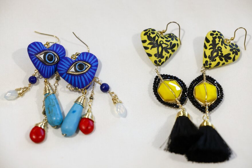 Two pairs of colorful earrings.