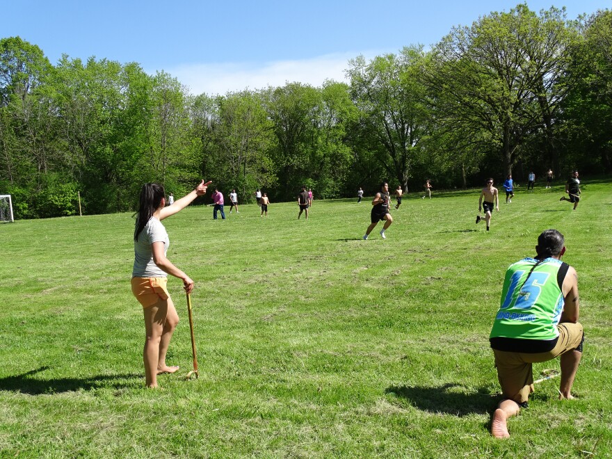 Averie Anderson (left foreground) coaching from the sidelines.