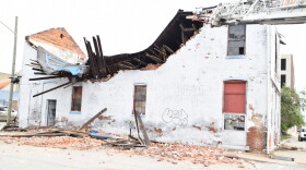 An Indianapolis firefighter was slightly injured Monday during the rescue of a man from this partially collapsed building.
