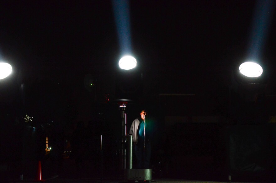 Surrounded by beams of lights, a man walks up to a microphone and tells the person across the border that he's new to El Paso. He moved here a few years ago from Ciudad Juarez, and says he misses it. The voice on the other side tells him to visit and they'll get tacos together.