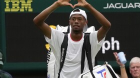 Christopher Eubanks of the US gestures to the crowd after losing to Russia's Daniil Medvedev in their men's singles match on day ten of the Wimbledon tennis championships in London, Wednesday, July 12, 2023. (AP Photo/Alastair Grant)