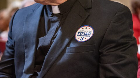 Stickers saying “repeal and replace Amendment 3” are distributed during Missouri Right to Life advocacy day at the Missouri State Capitol on March 26, 2025.
