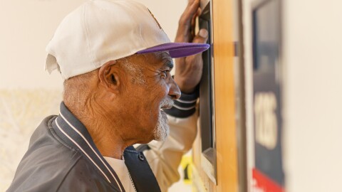 Donald Turnetine, who graduated from Mathewson in 1969, looks into a classroom that was built after his graduation. After Turnetine's graduation, Mathewson was closed and many students were bussed to different schools as part of integration efforts. "I'm one of the last legendaries that was bused when they started cross-busing," Turnetine said.