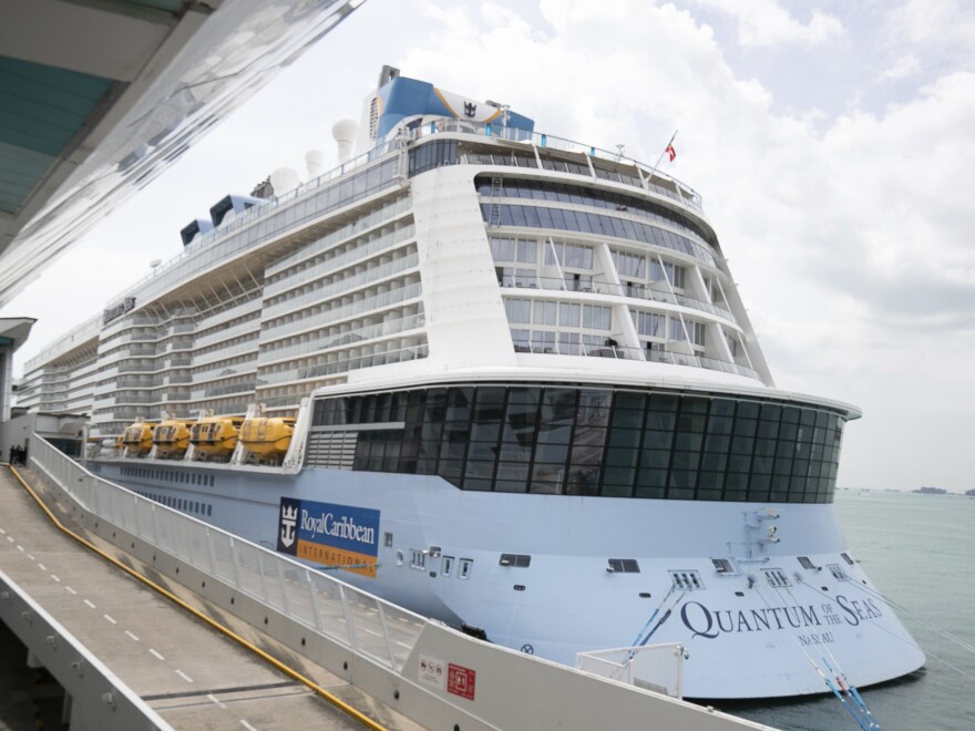 Royal Caribbean said that a guest on the Quantum of the Seas, shown here Wednesday in Singapore, tested positive for coronavirus after checking in with its medical team. The ship returned to port in accordance with government protocols.