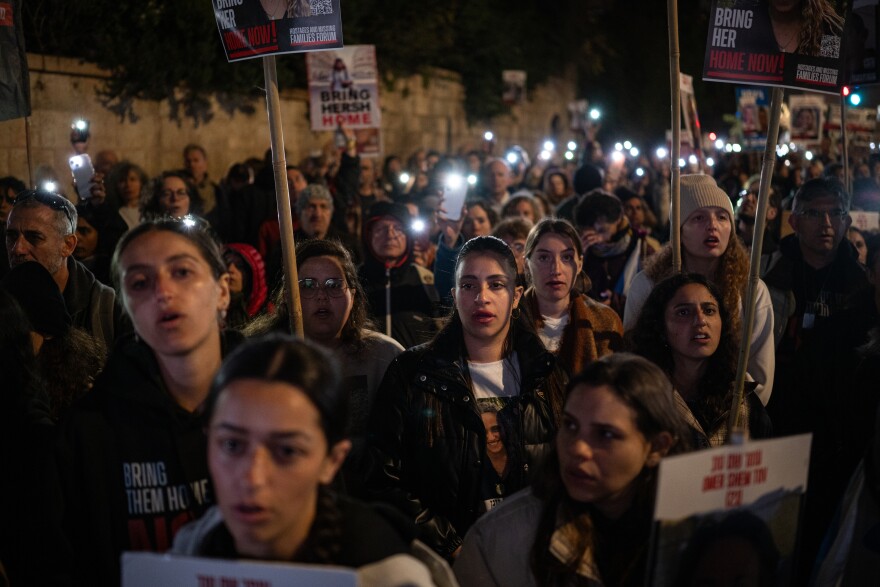 Family members of the hostages still held in Gaza and their supporters sing Israel's national anthem, Hatikvah, at the end of a rally that concluded their four-day march to Jerusalem on March 2.<strong> </strong>Darya Gonen(second row, right), was among them, wearing a black T-shirt with her sister's photo on it.